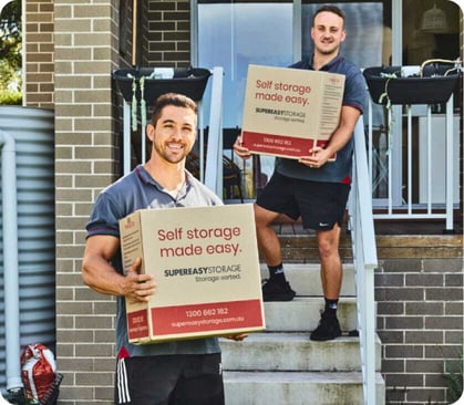 Family sitting together outside after a move