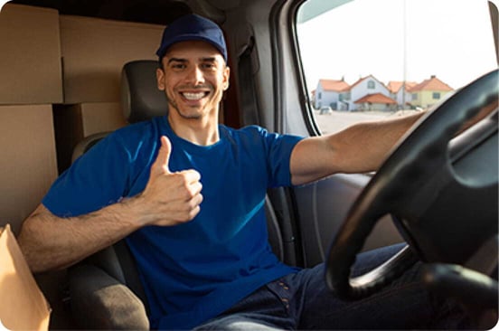 Team member standing in front of storage units